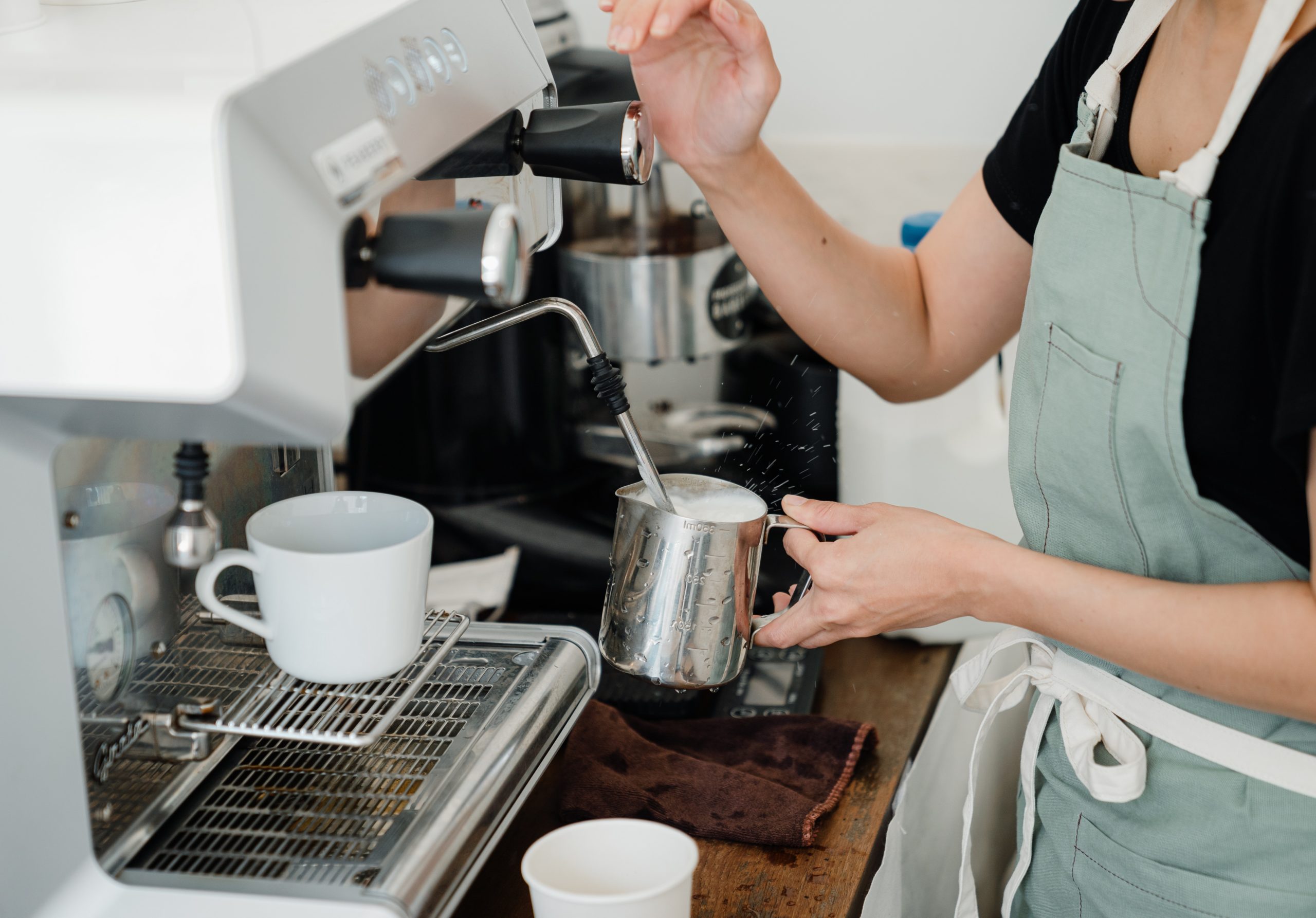 person making coffee