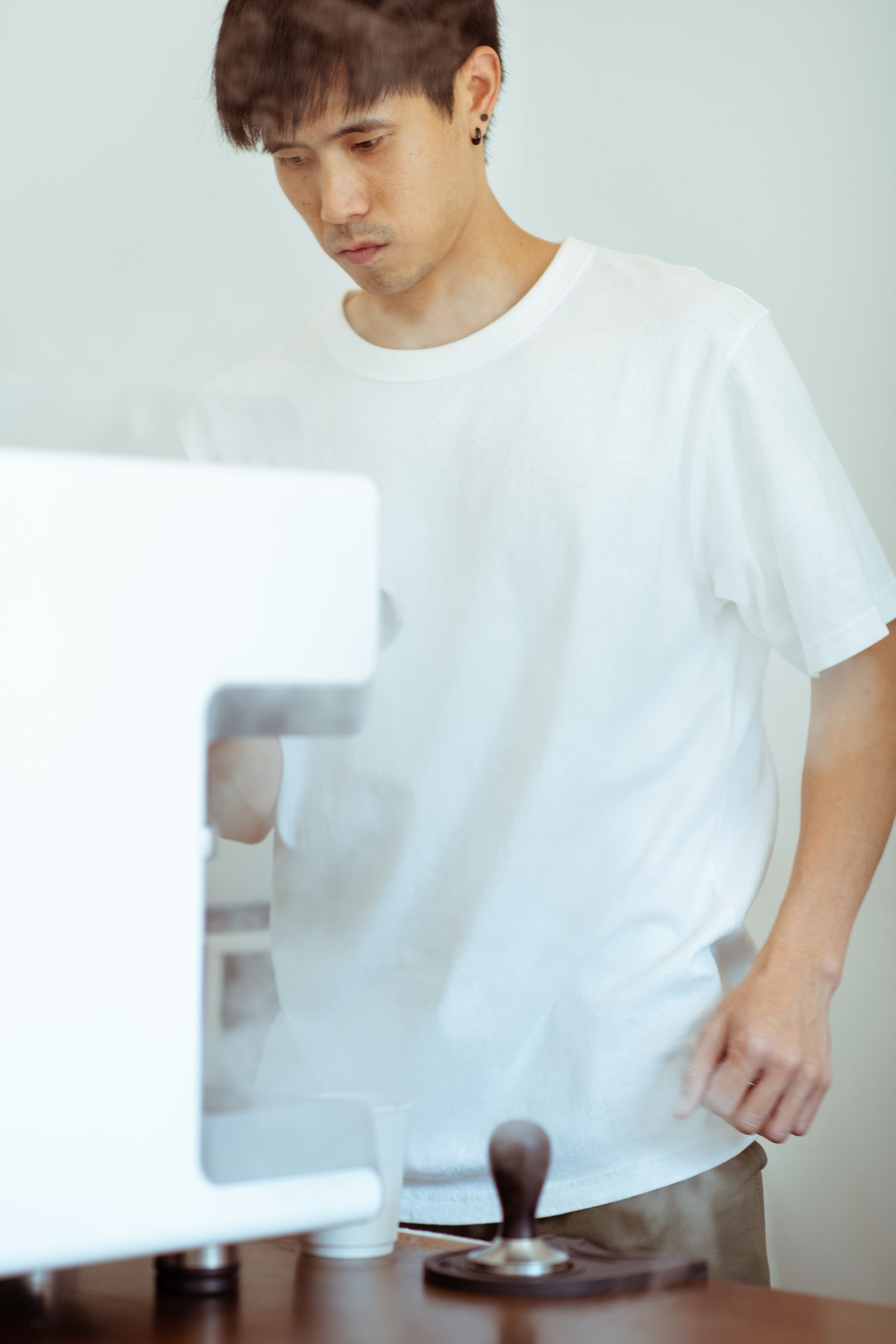 person using coffee machine